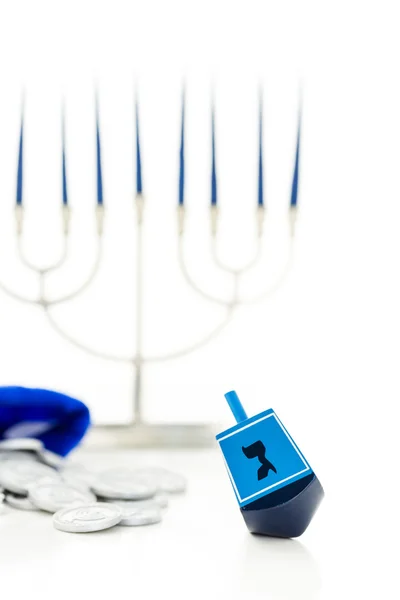 Blue dreidel with silver tokens, Hanukkah — Stock Photo, Image