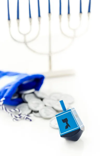 Blue dreidel with silver tokens, Hanukkah — Stock Photo, Image
