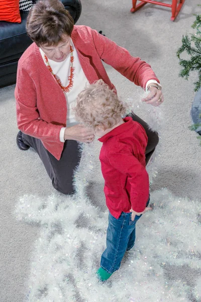 Grandmother and grandson decorating Christmas tree — Stock Photo, Image
