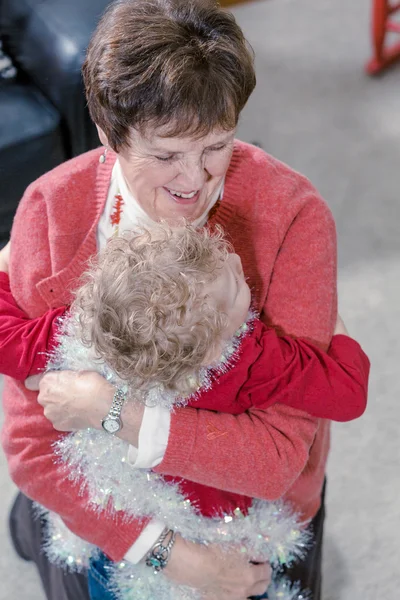 Grandmother and grandson decorating Christmas tree — Stock Photo, Image