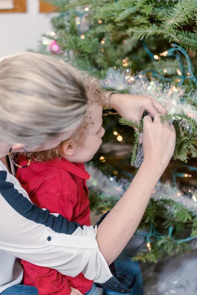 Mother and son decorating Christmas tree — Stock Photo, Image