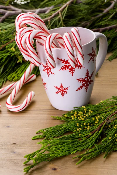 Traditional candy canes on wood table — Stock Photo, Image