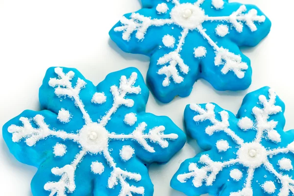 Blue cookies in shape of snowflakes — Stock Photo, Image