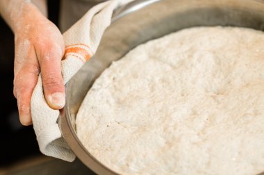 Baker preparing artisan sourdough bread clipart
