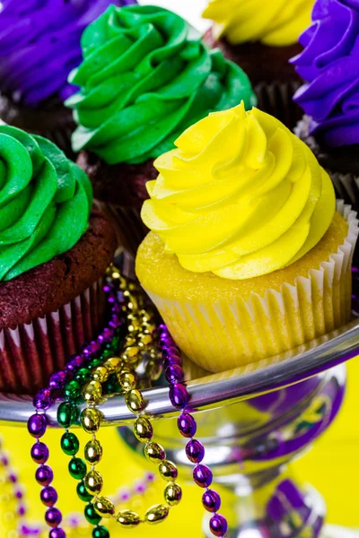 Cupcakes with colorful icing for Mardi Gras — Stock Photo, Image