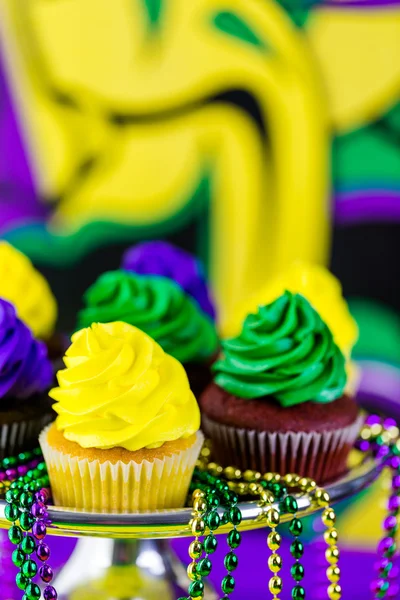 Cupcakes with colorful icing for Mardi Gras — Stock Photo, Image