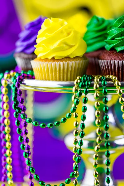 Cupcakes with colorful icing for Mardi Gras — Stock Photo, Image