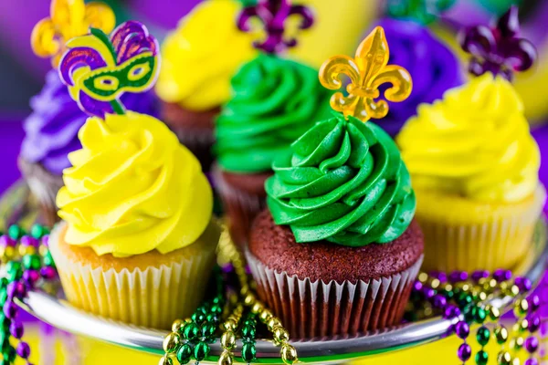 Cupcakes with colorful icing for Mardi Gras — Stock Photo, Image