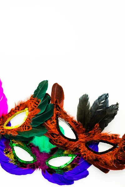 Různobarevné dekorace, pleťové masky na karneval — Stock fotografie