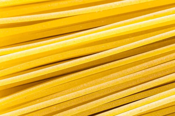 Organic yellow spaghetti pasta — Stock Photo, Image