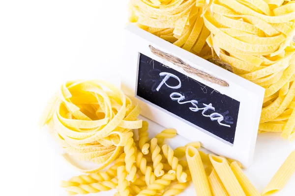 Organic yellow fettuccine nests pasta — Stock Photo, Image