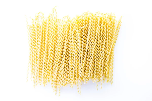 Organic yellow long pasta spirals — Stock Photo, Image