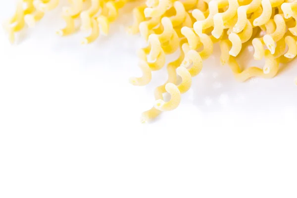 Organic yellow long pasta spirals — Stock Photo, Image