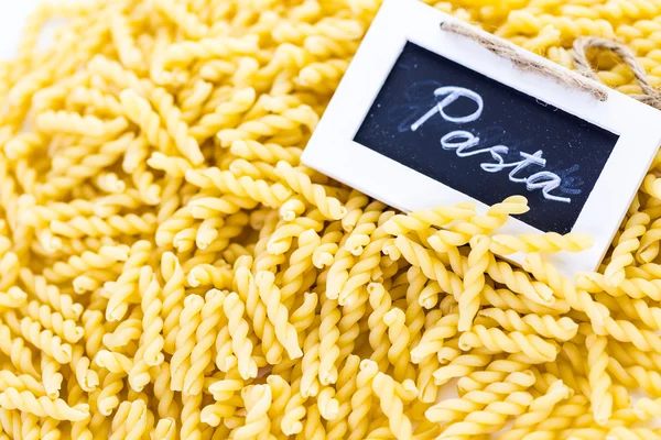 Organic yellow gemelli pasta — Stock Photo, Image