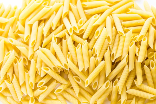 Organic yellow rigate pasta — Stock Photo, Image