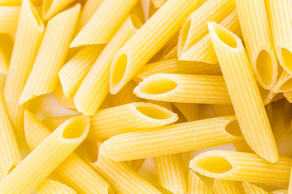 Organic yellow rigate pasta — Stock Photo, Image