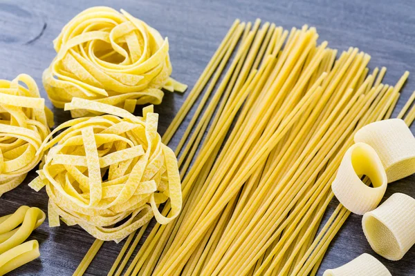 Variety of organic dry pasta — Stock Photo, Image