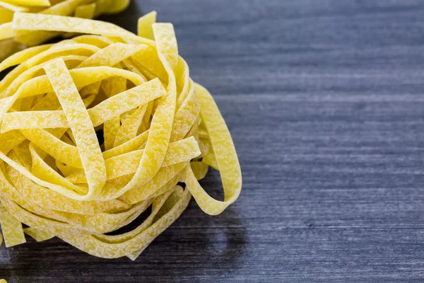 Organic fettuccine nests pasta — Stock Photo, Image