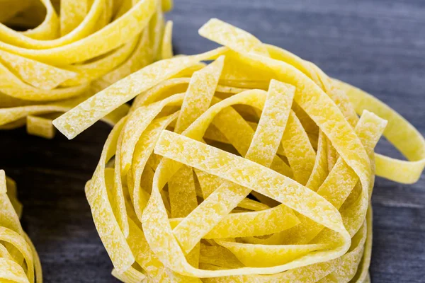 Organic fettuccine nests pasta — Stock Photo, Image