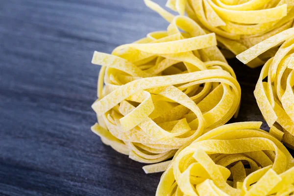 Organic fettuccine nests pasta — Stock Photo, Image