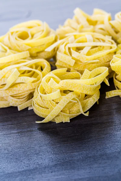 Organic fettuccine nests pasta — Stock Photo, Image