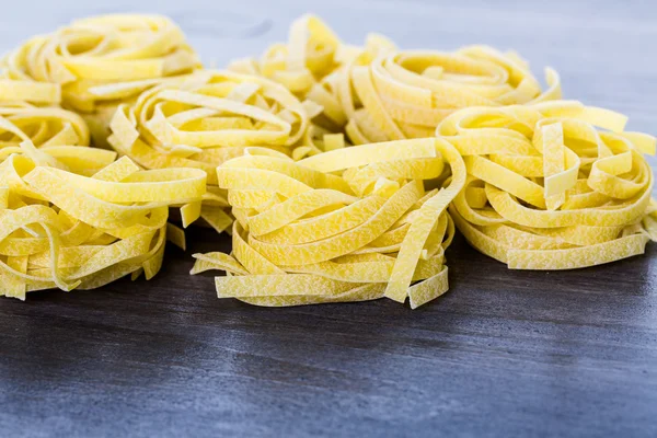 Organic fettuccine nests pasta — Stock Photo, Image