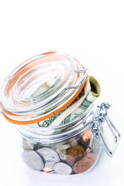 Saving money into glass jar — Stock Photo, Image