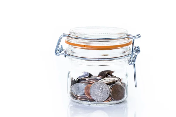 Saving money into glass jar — Stock Photo, Image