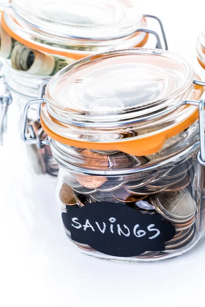 Saving money into glass jar — Stock Photo, Image