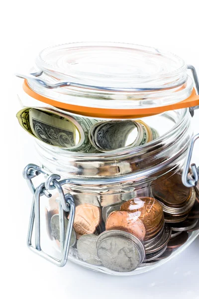 Saving money into glass jar — Stock Photo, Image