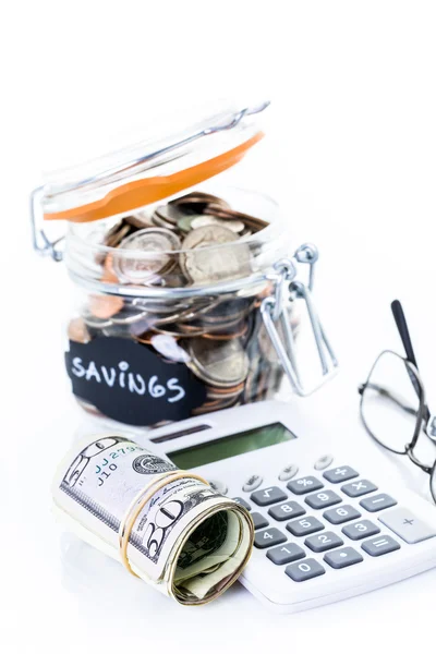 Saving money into glass jar — Stock Photo, Image