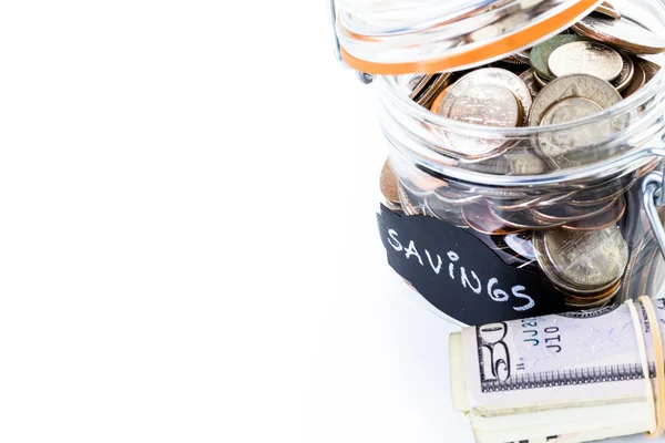 Saving money into glass jar — Stock Photo, Image