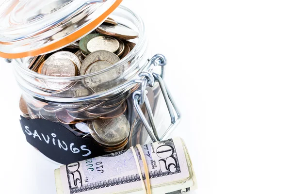 Saving money into glass jar — Stock Photo, Image