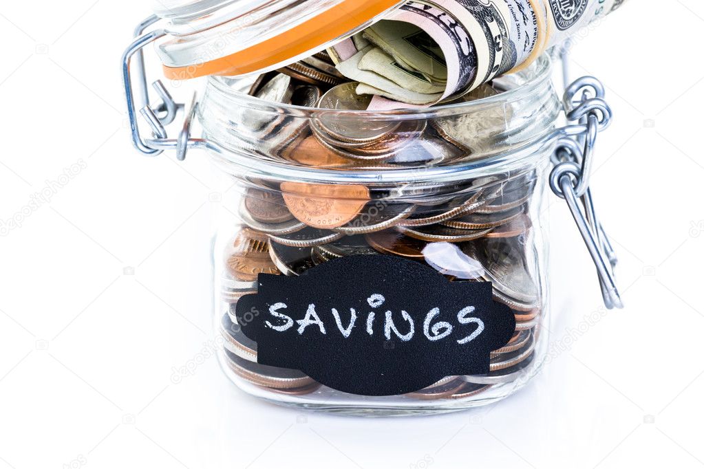Saving money into glass jar