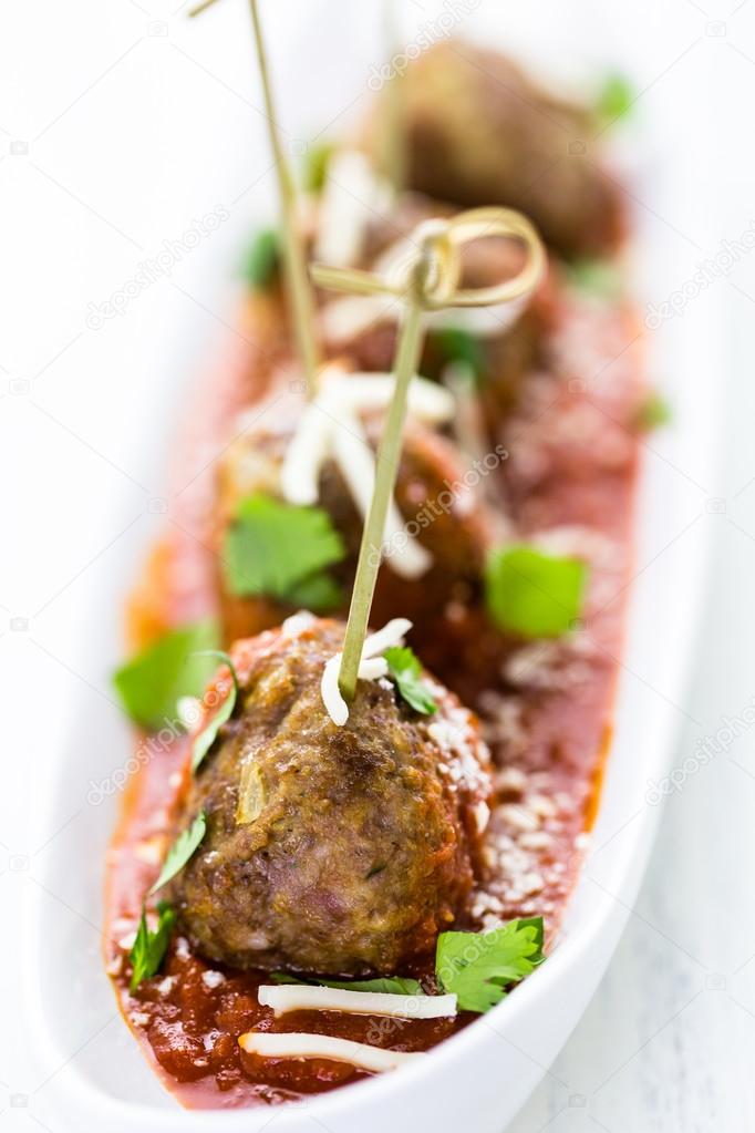 Large Italian meatballs with cilantro and parmesan cheese