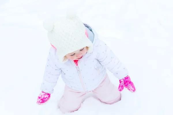 Baby girl and fresh snow — Stock Photo, Image