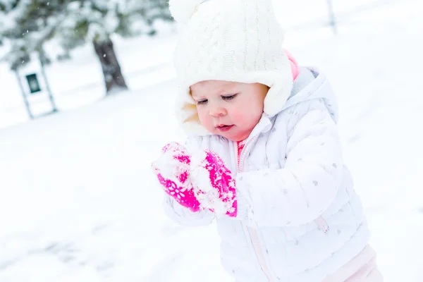 Baby girl and fresh snow — Stock Photo, Image