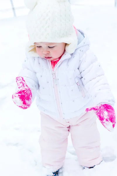 Baby girl and fresh snow — Stock Photo, Image