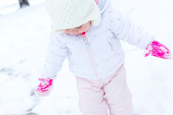 Baby girl and fresh snow — Stock Photo, Image