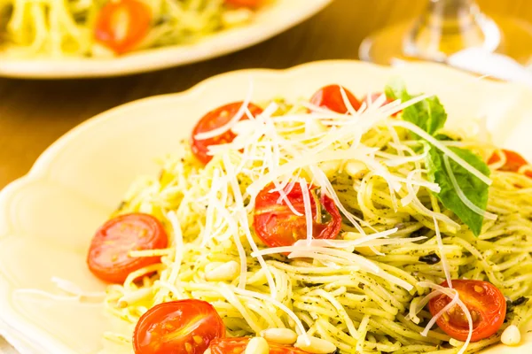 Homemade angel hair pasta with pesto sauce — Stock Photo, Image