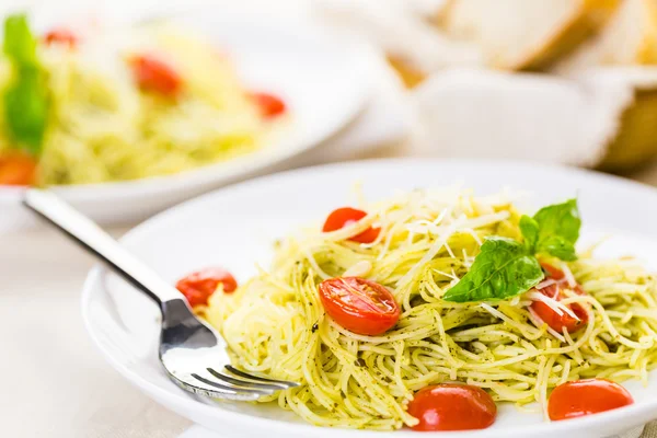 Homemade angel hair pasta with pesto — Stock Photo, Image