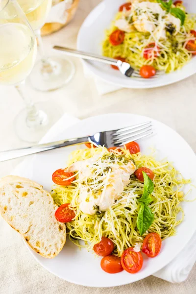 Homemade angel hair pasta with pesto sauce — Stock Photo, Image