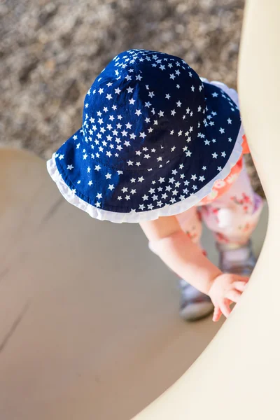 Toddler girl playing on tot lot — Stock Photo, Image