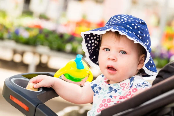 Cute toddler girl in stroller — Stock Photo, Image