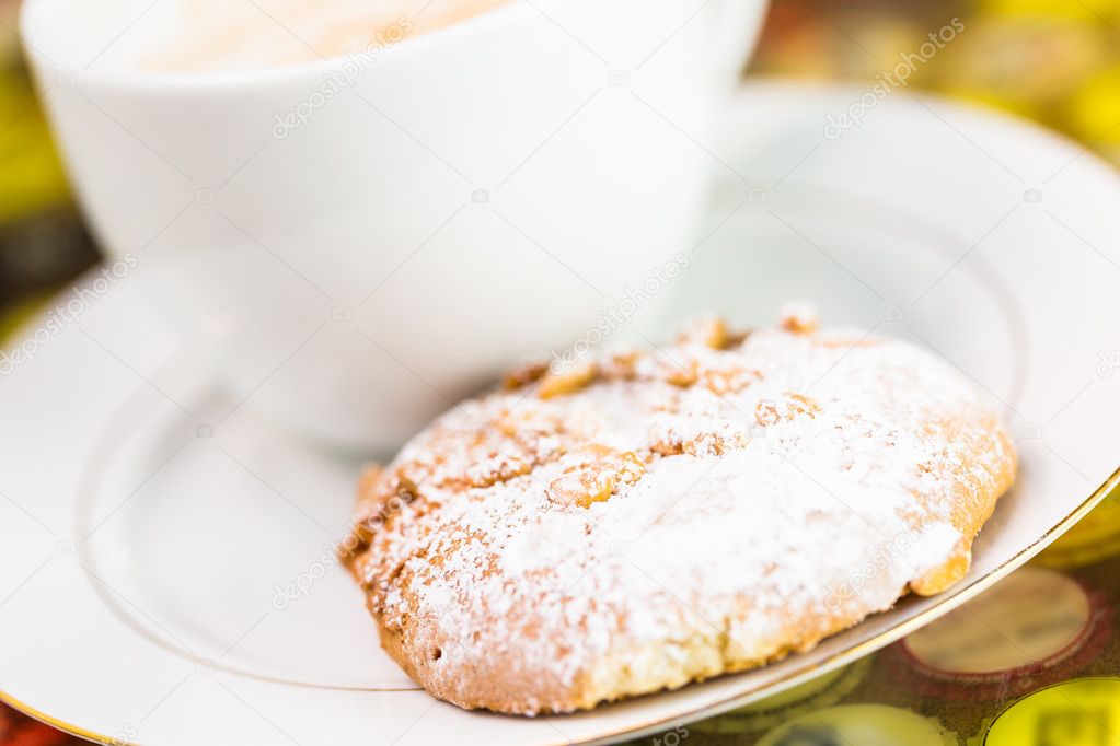 Coffee with cookie close up