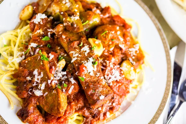 Fresh spaghetti with sausage — Stock Photo, Image