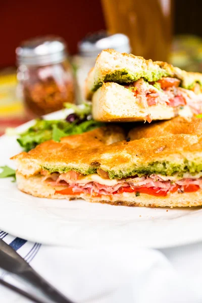 Prosciutto and provolone with pesto sandwich — Stock Photo, Image