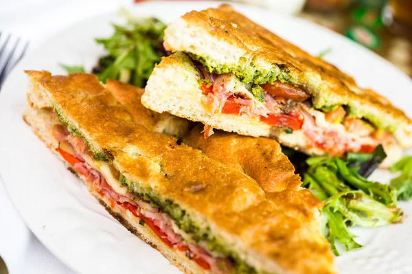 Prosciutto and provolone with pesto sandwich — Stock Photo, Image