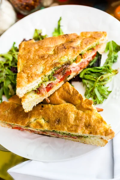 Prosciutto and provolone with pesto sandwich — Stock Photo, Image