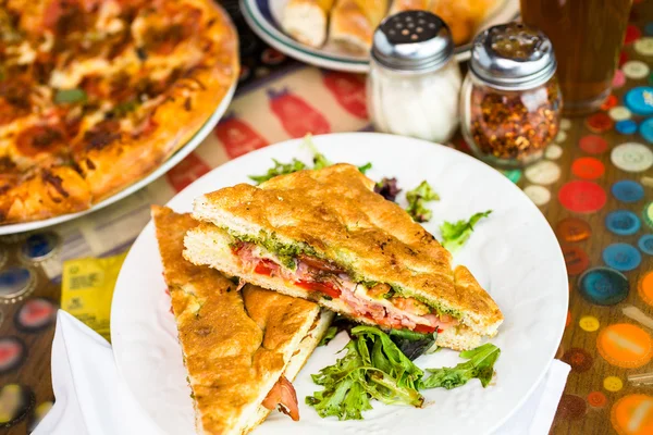 Prosciutto and provolone with pesto sandwich — Stock Photo, Image